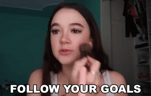 Woman Applying Makeup Follow Your Goals