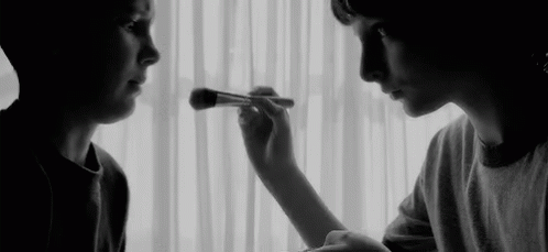 Woman Applying Makeup to Another