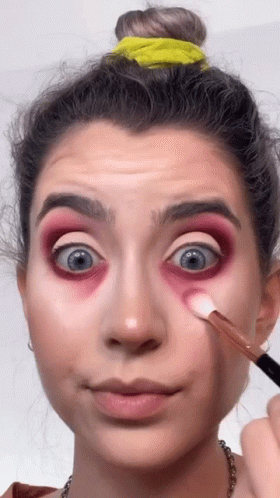 Woman Applying Makeup with Brush