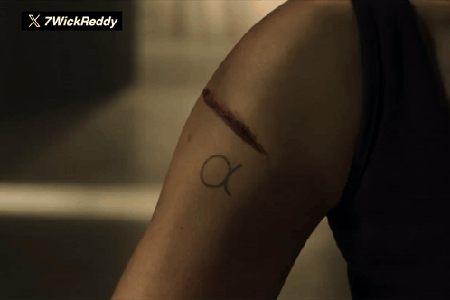 Woman Arm Tattoo Letter A GIF