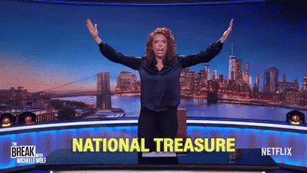 Woman Arms Outstretched in Front of National Treasure Screen