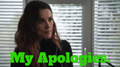 Woman at Blinds Saying My Apologies in Green