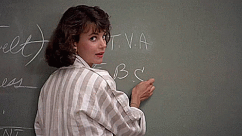 Woman at Chalkboard With T.V.A