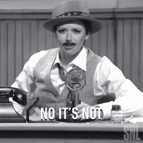 Woman at Desk Saying No It's Not