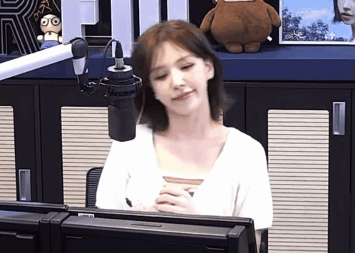 Woman at Microphone in Radio Studio