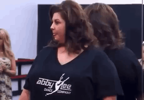 Woman at Mirror in Black Shirt