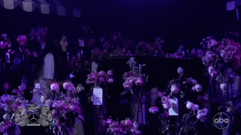 Woman at Piano with Purple Flowers
