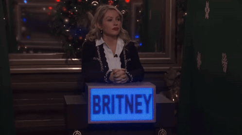Woman At Podium Saying Britney GIF