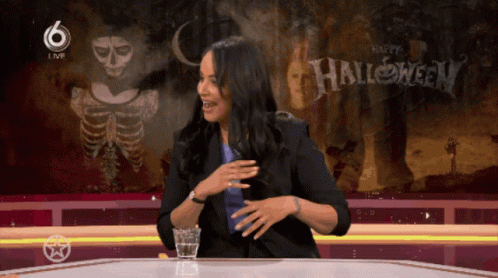 Woman at Screen Saying Happy Halloween