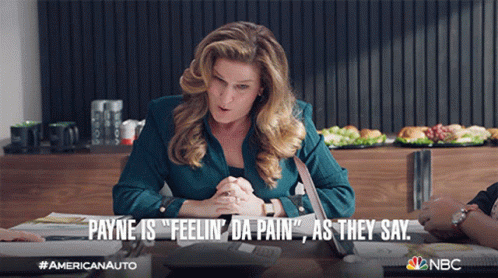 Woman at Table Payne Is Feelin Da Pain