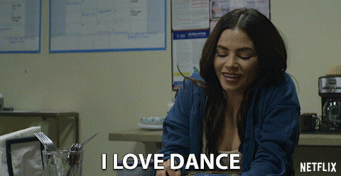 Woman at Table Saying I Love Dance