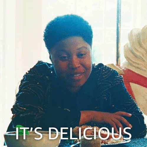 Woman At Table Saying It's Delicious GIF