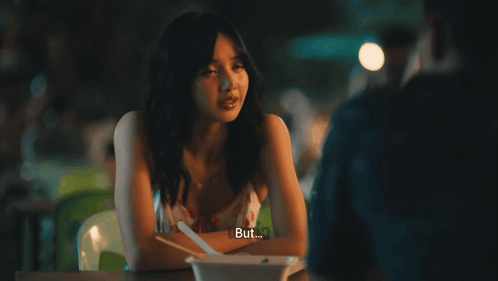 Woman at Table With Bowl Saying Defense