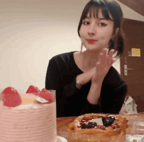 Woman at Table with Cake and Pastry