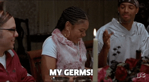 Woman at Table With Candle Says My Germs
