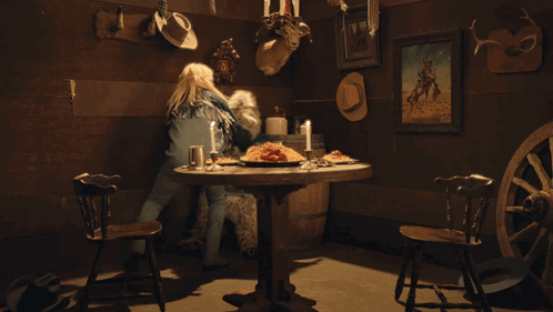 Woman At Table With Food And Candles GIF