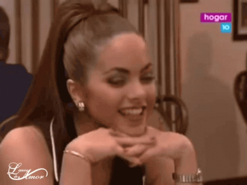 Woman At Table With Hogar Sign GIF
