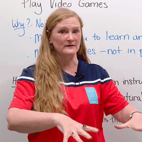 Woman at White Board Saying Play Video Games
