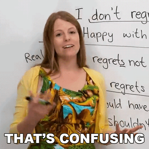 Woman at Whiteboard Saying That's Confusing