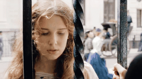 Woman Behind Bars Eyes Closed Man Holding Her Hand GIF