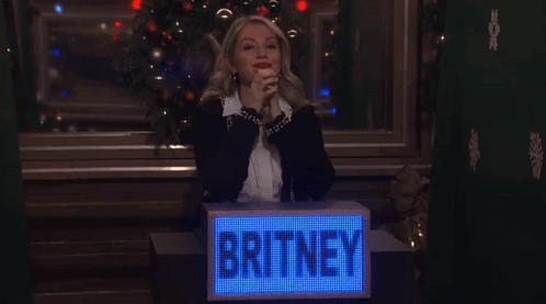 Woman Behind Box Saying Britney GIF