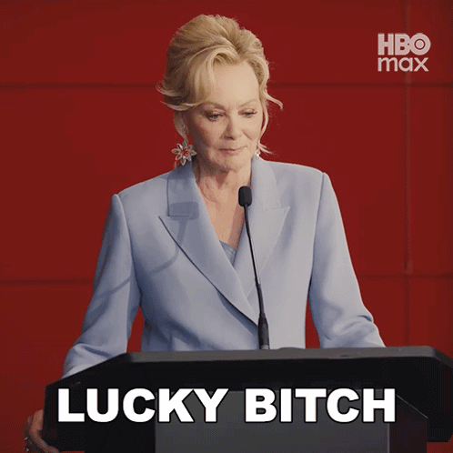 Woman Behind Podium Saying Lucky Bitch