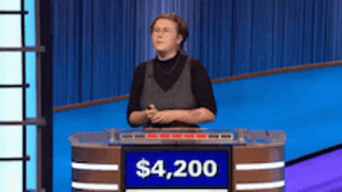 Woman Behind Podium With Sign Saying $4,200 GIF