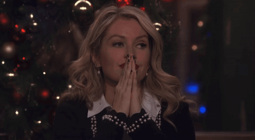 Woman Behind Sign Saying Britney GIF