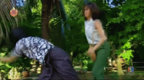 Woman Beside Man In Jungle GIF