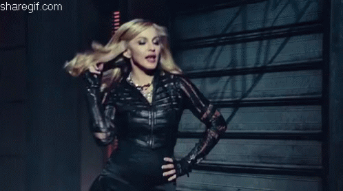 Woman Black Leather Jacket And Gloves Garage Door GIF