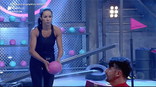 Woman Black Top Holding Pink Ball Beside Man