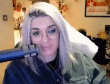 Woman Blow Drying Hair in Front of Nuka Cola Poster