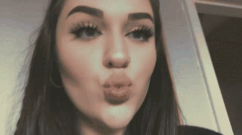 Woman Blowing a Kiss