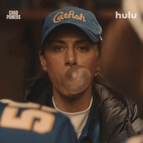 Woman Blowing Bubble With Catfish Hat