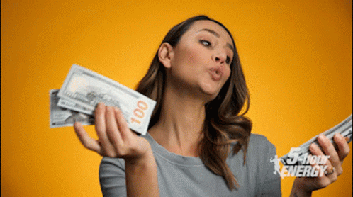 Woman Blowing Kiss Holding 100 Dollar Bills