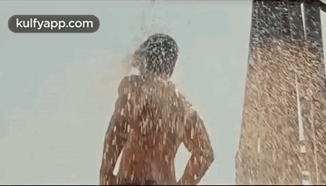 Woman Blowing Kiss In Front Of Water GIF
