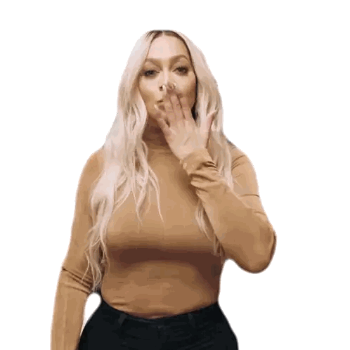 Woman Blowing Kiss in Tan Turtleneck