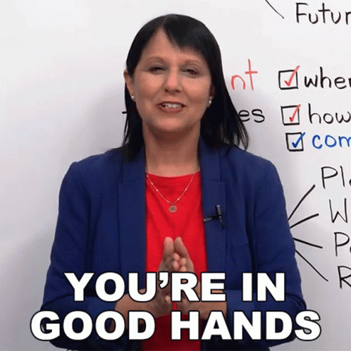 Woman Blue Jacket Red Shirt Saying You're in Good Hands