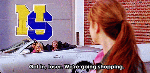 Woman by Car Saying Get In Loser We're Going Shopping