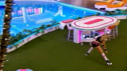 Woman By Pink And White Table In Pool Area GIF