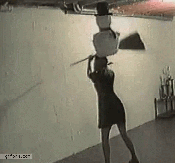 Woman Carrying Snowman On Head Holding Stick GIF