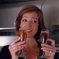 Woman Cheers For Prosecco Glass GIF