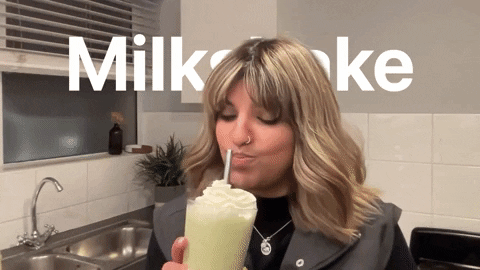 Woman Cheers Milkshake GIF