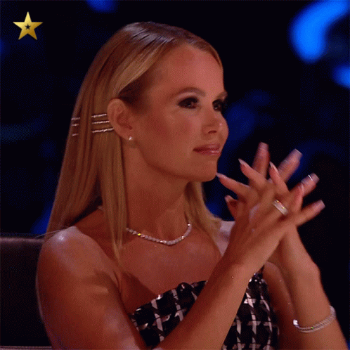 Woman Clapping Hands in Front of Star
