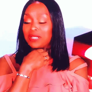 Woman Close Eyes Clutching Pearls GIF