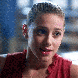 Woman Close Up In Red Shirt With Ponytail GIF