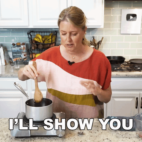 Woman Cooking in Kitchen Saying Ill Show You