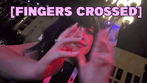 Woman Covering Face Fingers Crossed