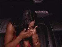 Woman Covering Face While Sitting in Car
