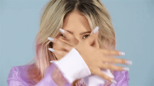 Woman Covering Face With Blue Circle Behind Her